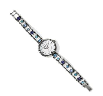 Collection: Halo  Color: Silver-Tanzanite  Closure: Fold-over clasp  Length: 6 1/4" - 8" Adjustable  Face Diameter: 1 1/8"  Material: Swarovski crystal  Finish: Silver plated
